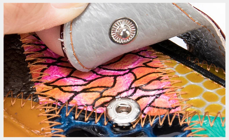 Elegant, compact women's wallet featuring a two-tone design, coin pocket, multiple card slots, and a money clip; crafted from high-quality genuine leather.