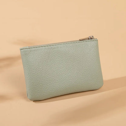 Small and elegant women's wallet with zipper closure, card holder and key holder