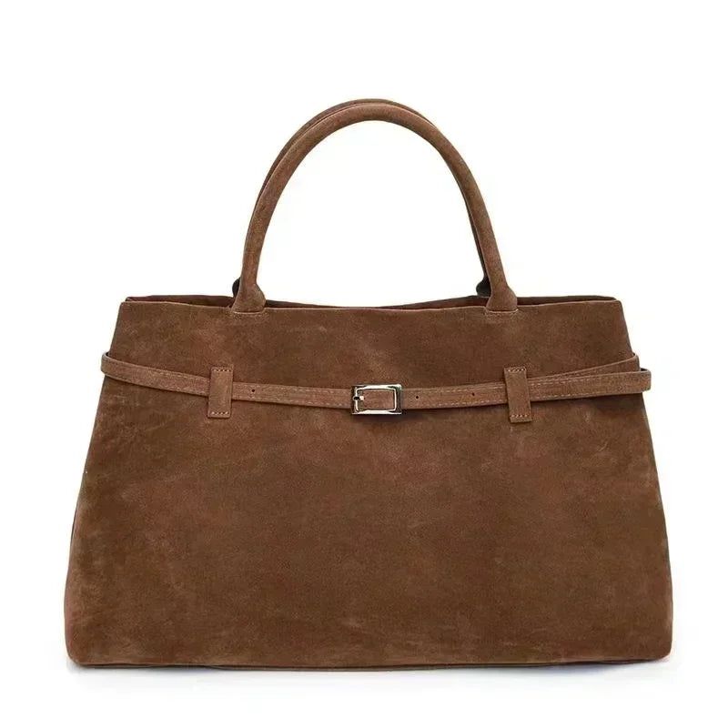 Women's handbag made of synthetic suede with a decorative buckle, large capacity, and snap closure