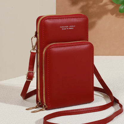 Modern, compact, and secure women's cell phone bag. Holds phones, cards, and documents