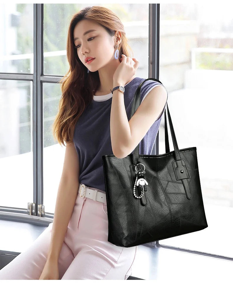 Stylish and elegant women's square tote bag with a horizontal zipper, suitable for carrying by hand or on the shoulder
