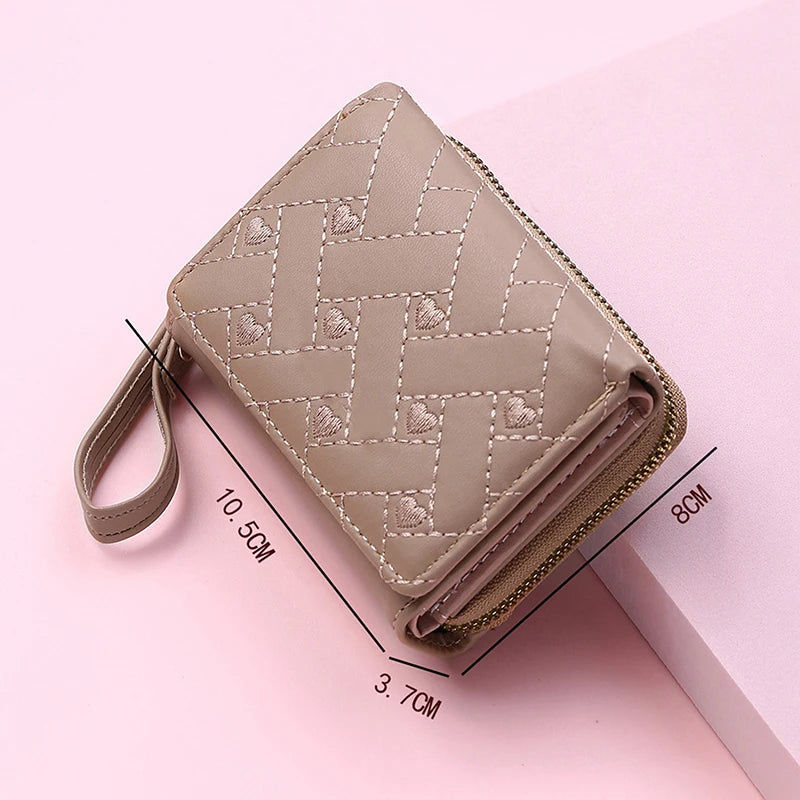 Small women's wallet in leather, elegant design, available in various colors.