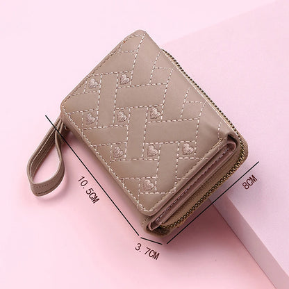 Small women's wallet in leather, elegant design, available in various colors.