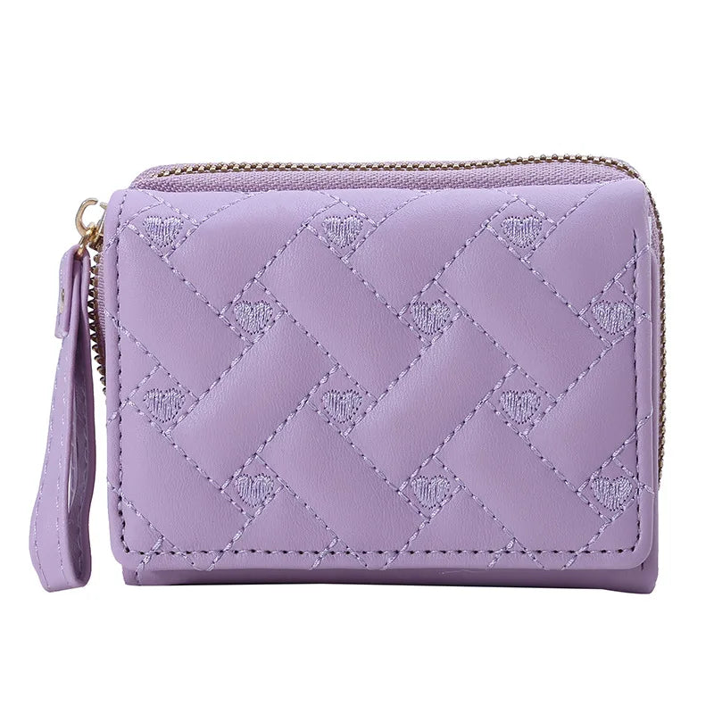 Small women's wallet in leather, elegant design, available in various colors.