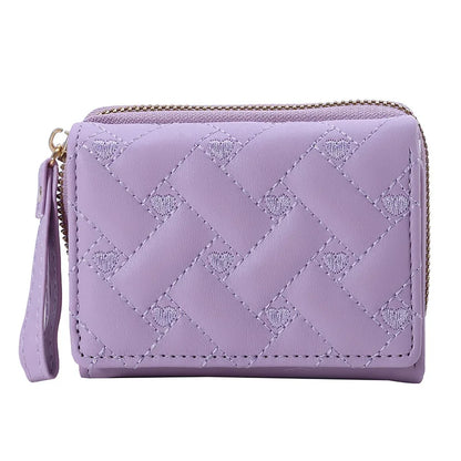 Small women's wallet in leather, elegant design, available in various colors.