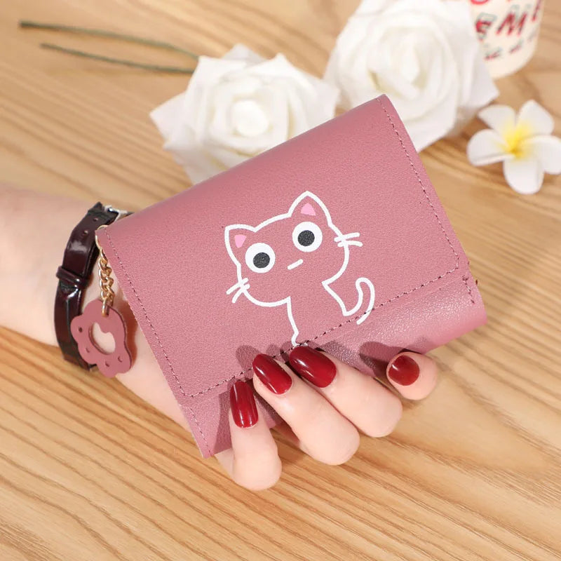 Small and compact women's wallet for girls with a cat print, featuring card slots and a bill compartment.