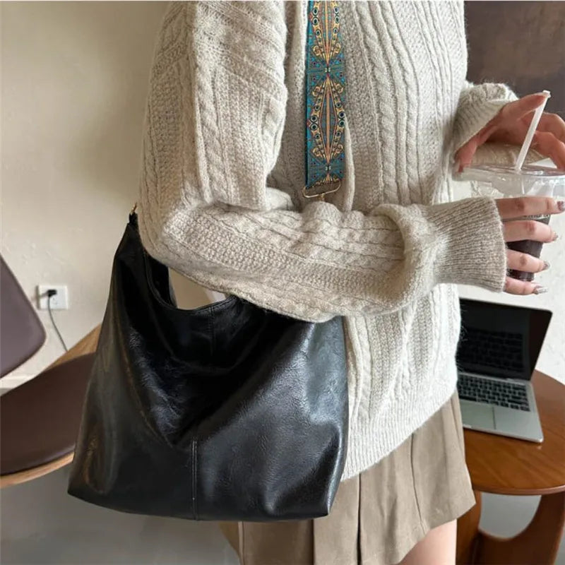 Women's bohemian-style handbag with vintage embroidery and a wide strap