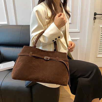 Women's handbag made of synthetic suede with a decorative buckle, large capacity, and snap closure