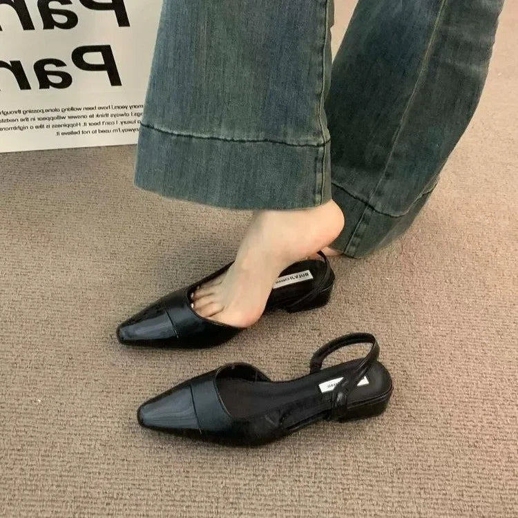 Women's low-heeled shoe with a pointed toe, chunky heel, and comfortable fit