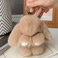 Adorable and fun women's keychain with a rabbit fur pendant.