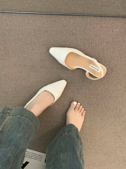 Women's low-heeled shoe with a pointed toe, chunky heel, and comfortable fit