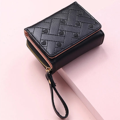 Small women's wallet in leather, elegant design, available in various colors.