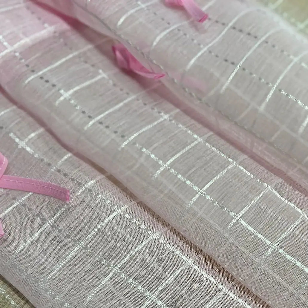 Short curtains made of pink checkered tulle and sheer voile for kitchen cabinets, doors, and windows.