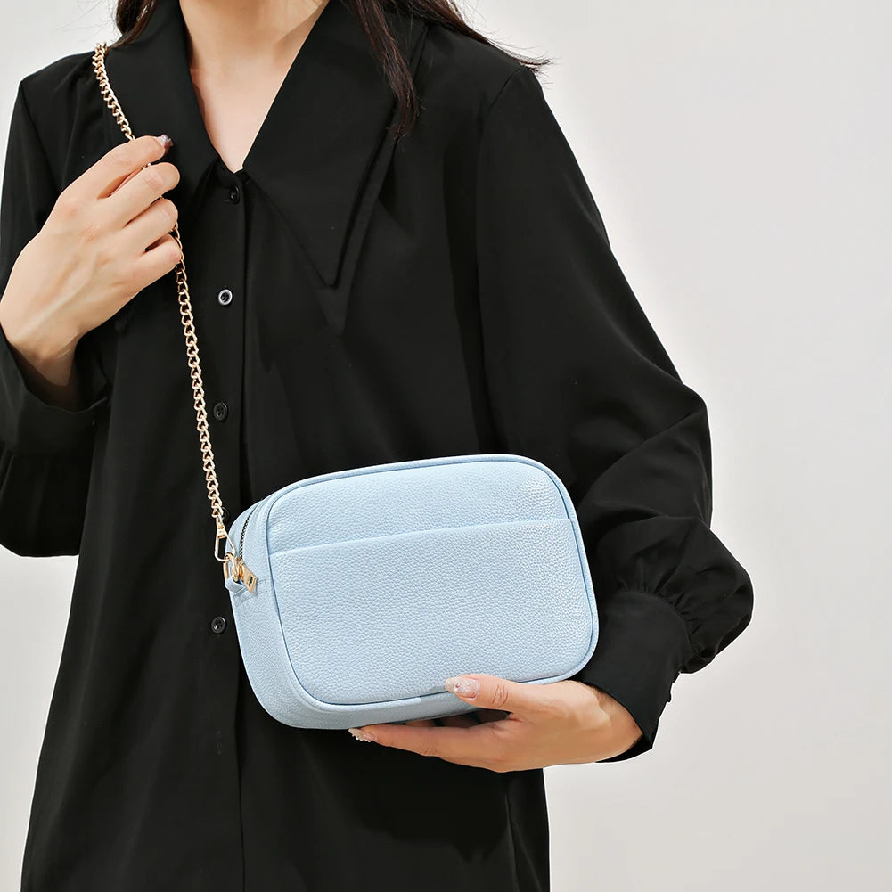 Women's leather tote bag, classic style with crossbody strap and chain detail