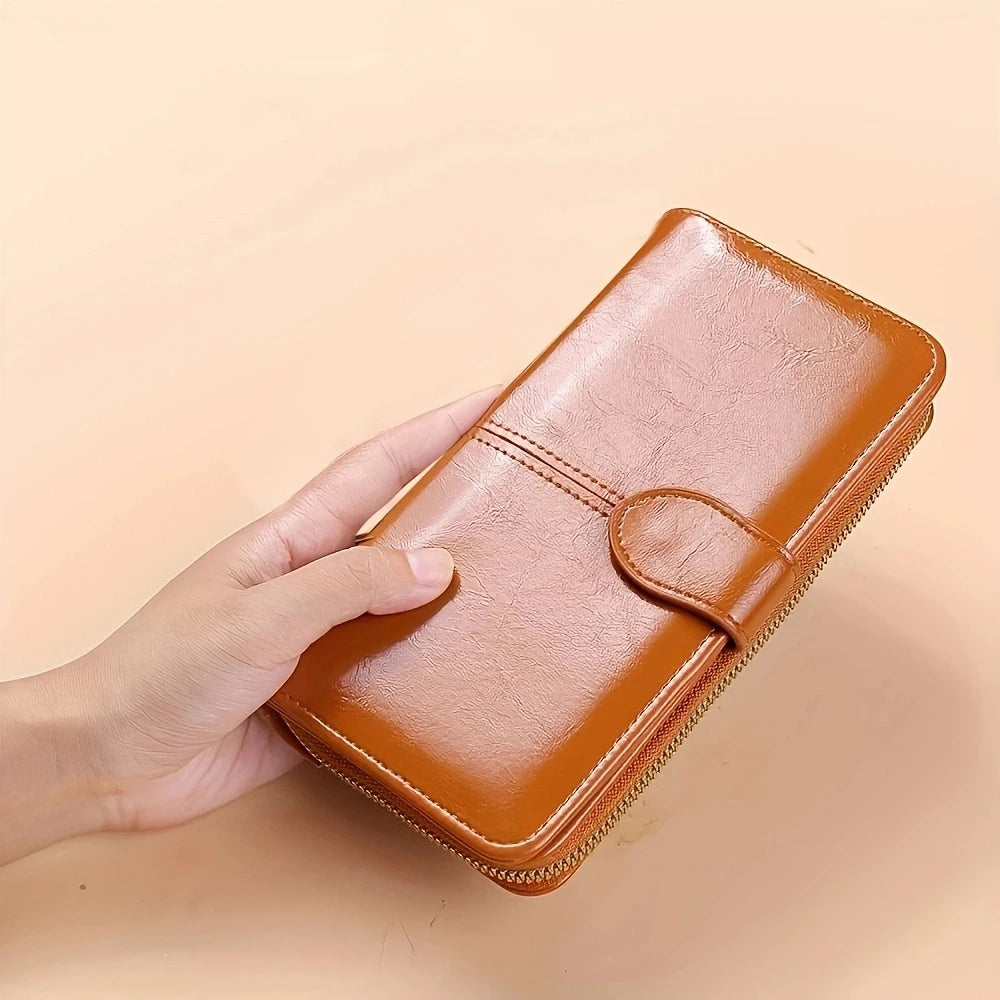 Women's leather wallet with coin and card compartments, available in a variety of colors.