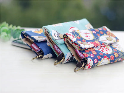 Women's wallet with cartoon print for girls, with key holder and coin purse in various designs.