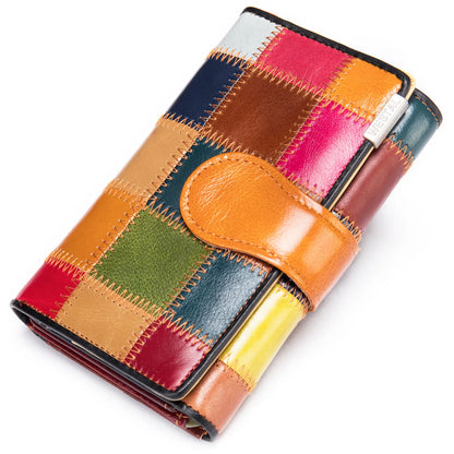 Elegant, compact women's wallet featuring a two-tone design, coin pocket, multiple card slots, and a money clip; crafted from high-quality genuine leather.
