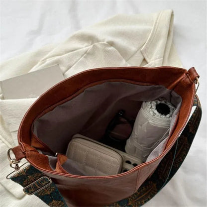 Women's bohemian-style handbag with vintage embroidery and a wide strap