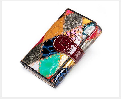 Elegant, compact women's wallet featuring a two-tone design, coin pocket, multiple card slots, and a money clip; crafted from high-quality genuine leather.