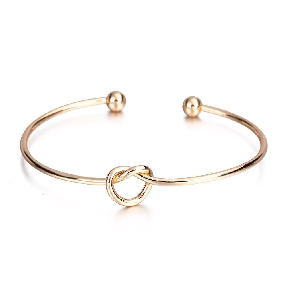 Women's rigid stainless steel bracelet with knot detail