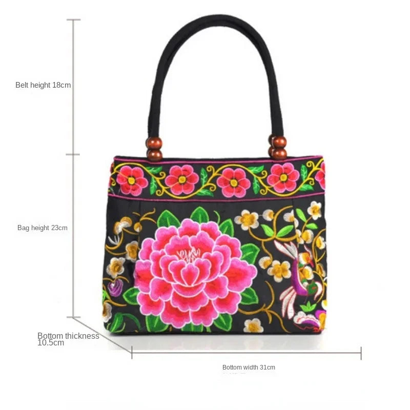 Small women's shoulder bag with floral embroidery, top handle, and flap with bead embellishments