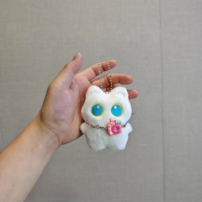 Black and white kitten keychain with big, cute eyes, cartoon plush pendant