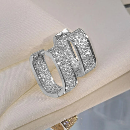Women's silver or gold hoop earrings set with cubic zirconia