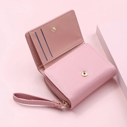 Small women's wallet in leather, elegant design, available in various colors.