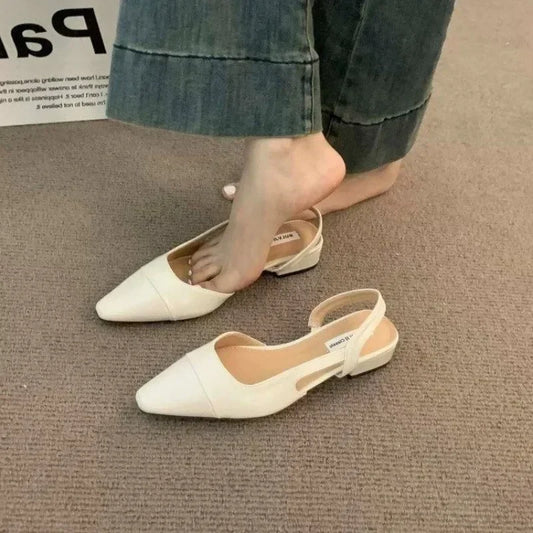 Women's low-heeled shoe with a pointed toe, chunky heel, and comfortable fit