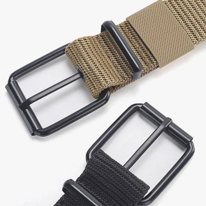 Unisex canvas belt with pin buckle and leather detail. Modern with eyelets and perfect for wearing with jeans.