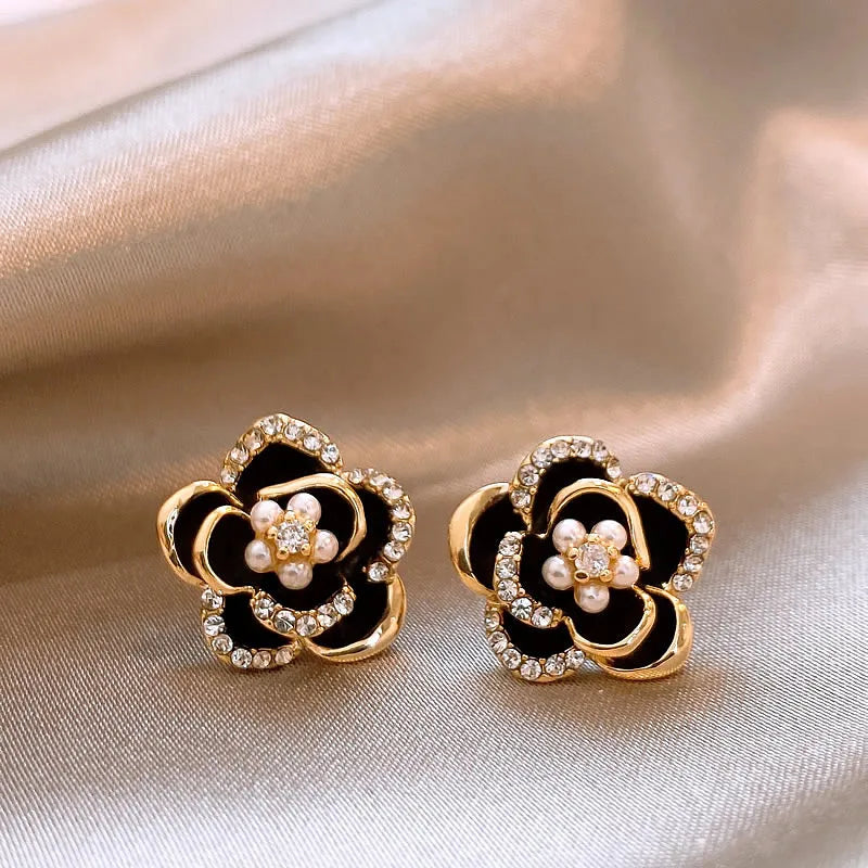 Black Camellia earrings with embedded cubic zirconia and rhinestones, modern and delicate