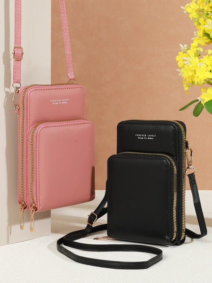 Modern, compact, and secure women's cell phone bag. Holds phones, cards, and documents