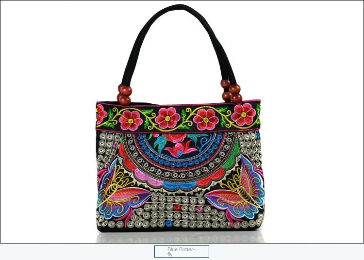 Small women's shoulder bag with floral embroidery, top handle, and flap with bead embellishments
