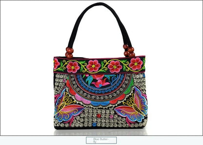 Small women's shoulder bag with floral embroidery, top handle, and flap with bead embellishments