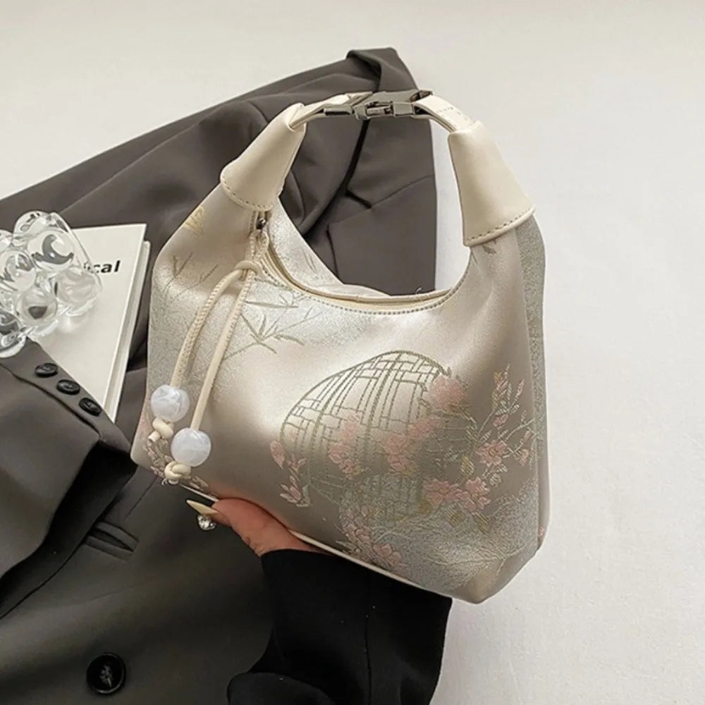 Women's embroidered handbag with zipper, made of silky fabric, adjustable strap