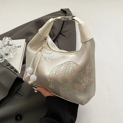 Women's embroidered handbag with zipper, made of silky fabric, adjustable strap