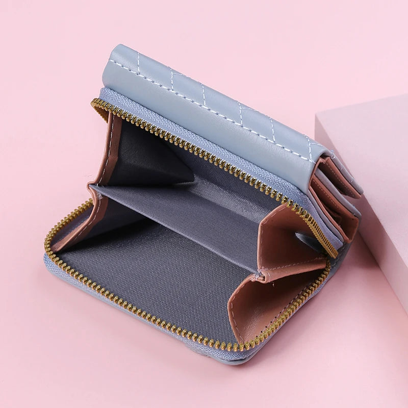 Small women's wallet in leather, elegant design, available in various colors.