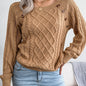 Women's sweater with puff sleeves, textured buttons, and a round neck
