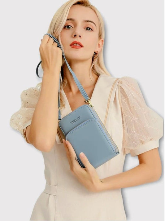 Modern, compact, and secure women's cell phone bag. Holds phones, cards, and documents
