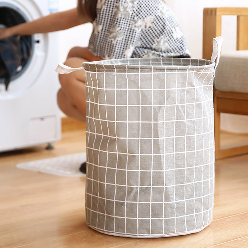 Round, portable fabric laundry basket, ideal for the laundry room or bathroom