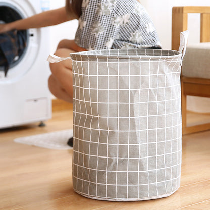 Round, portable fabric laundry basket, ideal for the laundry room or bathroom