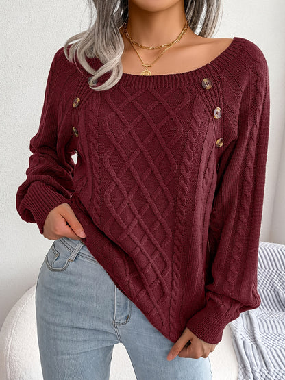 Women's sweater with puff sleeves, textured buttons, and a round neck