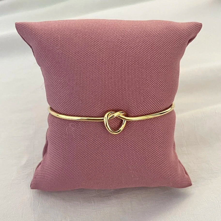 Women's rigid stainless steel bracelet with knot detail